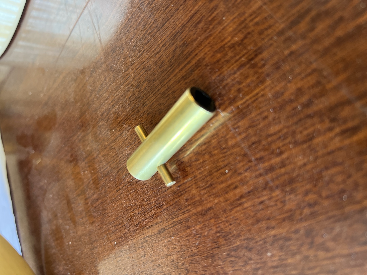 A brass tuning key